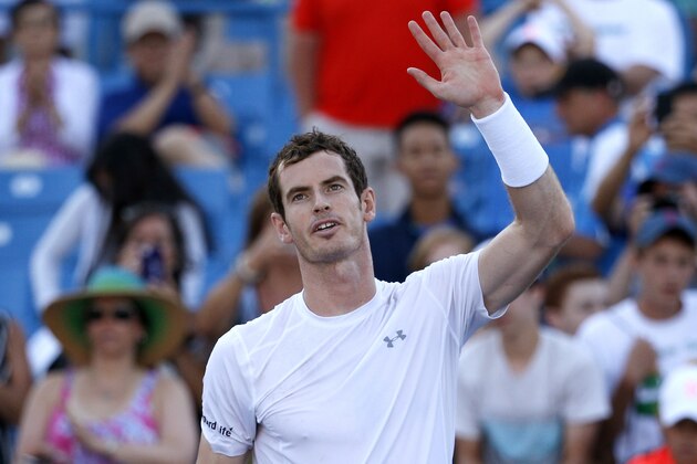 Andy Murray, of Britain, waves to the crowd after defeating Richard Gasquet, of France, 4-6, 6-1, 6-4 in a quarterfinal at the Western & Southern Open tennis tournament, Friday, Aug. 21, 2015, in Mason, Ohio. (AP Photo/John Minchillo)