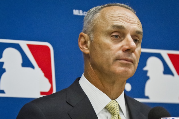 Baseball commissioner Rob Manfred listens during a press conference after his first owners' meeting as baseball commissioner, Thursday, May 21, 2015, in New York. (AP Photo/Bebeto Matthews)