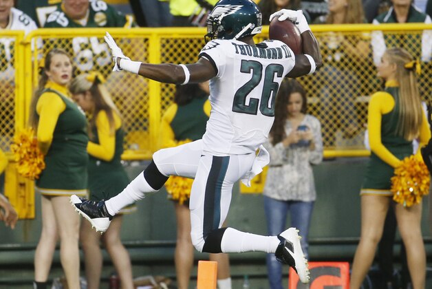Philadelphia Eagles' Walter Thurmond leaps into the end zone for a touchdown after intercepting a pass during the first half of an NFL football game against the Green Bay Packers Saturday, Aug. 29, 2015, in Green Bay, Wis. (AP Photo/Mike Roemer)