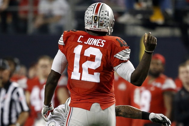 Ohio State's Cardale Jones (12) fumbles the ball during the second half of the NCAA college football playoff championship game against Oregon Monday, Jan. 12, 2015, in Arlington, Texas. (AP Photo/Brandon Wade)