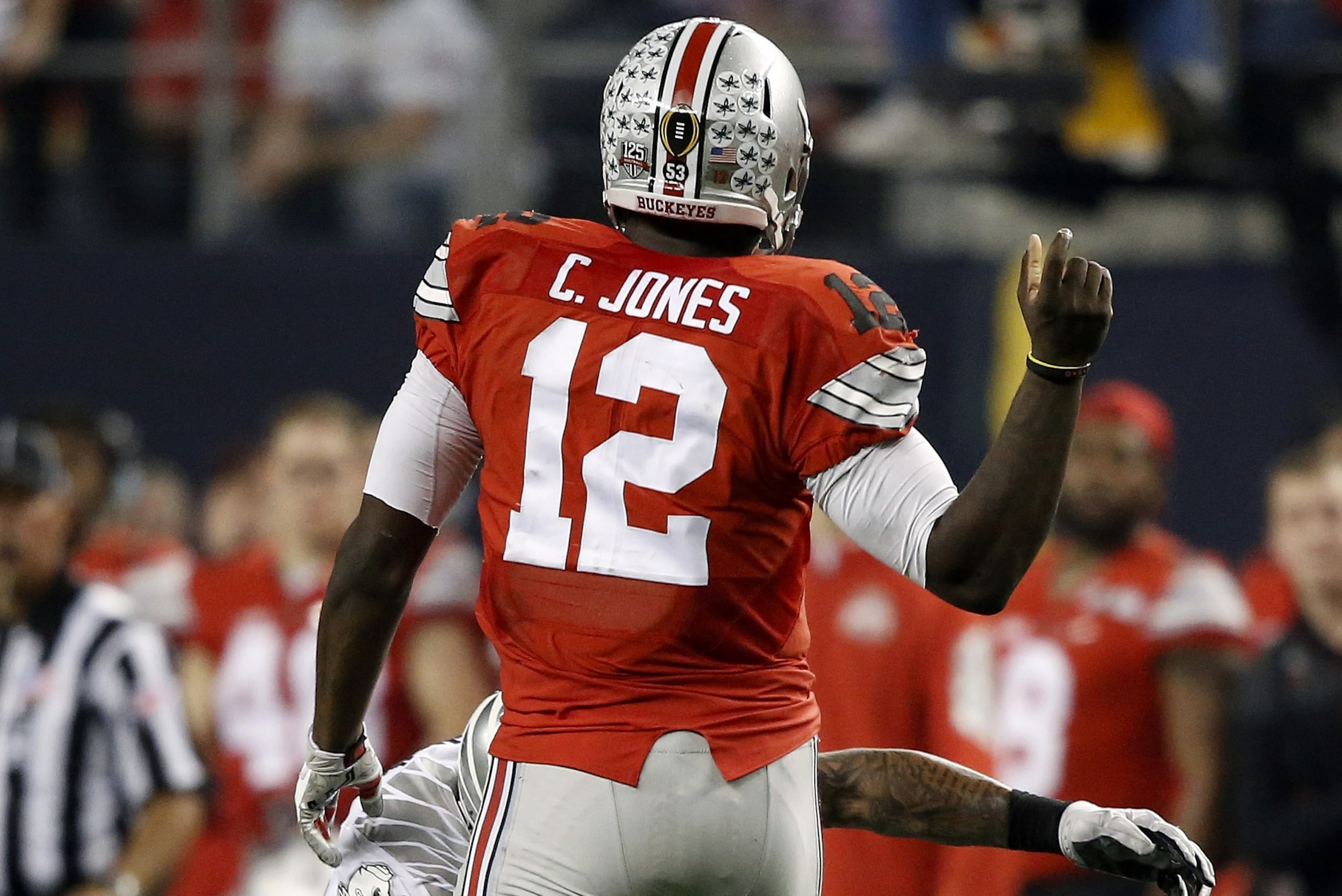 Ohio State's Cardale Jones (12) fumbles the ball during the second half of the NCAA college football playoff championship game against Oregon Monday, Jan. 12, 2015, in Arlington, Texas. (AP Photo/Brandon Wade)