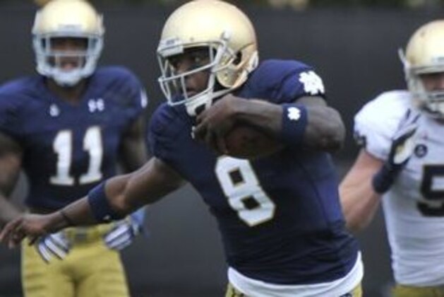 FILE - In this April 18, 2015, file photo, Notre Dame quarterback Malik Zaire (8) heads up field during the Blue Gold game in South Bend, Ind. Zaire will be Notre Dame's third starting quarterback in three years. (AP Photo/Joe Raymond)