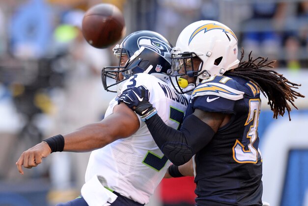 Aug 29, 2015; San Diego, CA, USA; Seattle Seahawks quarterback Russell Wilson (3) intentionally grounds the ball as San Diego Chargers defensive back Jahleel Addae (37) defends during the first quarter at Qualcomm Stadium. Mandatory Credit: Jake Roth-USA TODAY Sports