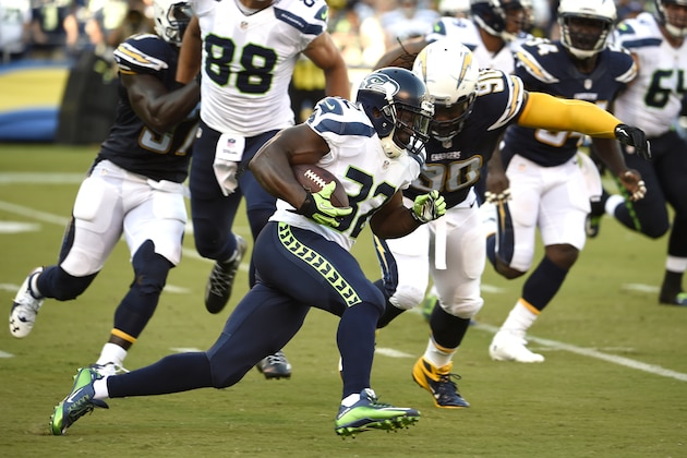 Seattle Seahawks running back Robert Turbin runs against the San Diego Chargers during the first half of an NFL preseason football game Saturday, Aug. 29, 2015, in San Diego. (AP Photo/Denis Poroy)