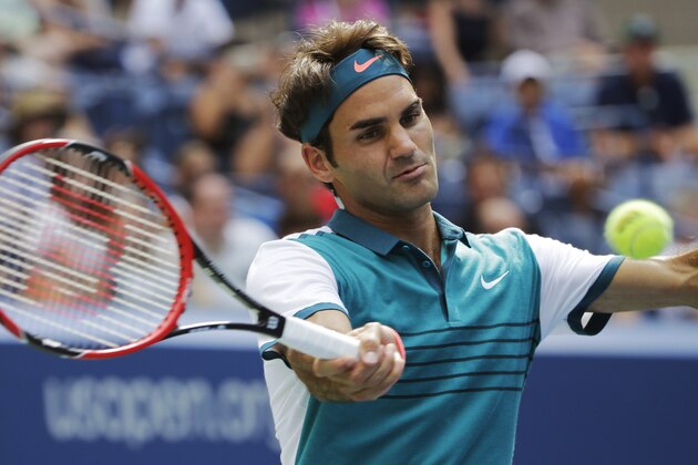 Roger Federer, of Switzerland, returns to Leonardo Mayer, of Argentina, during the first round of the U.S. Open tennis tournament, Tuesday, Sept. 1, 2015, in New York. (AP Photo/Matt Rourke)