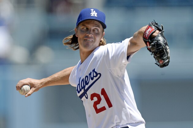 LOS ANGELES, CA - AUGUST 16:  Pitcher Zack Greinke #21 of the Los Angeles Dodgers umwids against the Cincinnati Reds during the first inning at Dodger Stadium August 16, 2015, in Los Angeles, California. (Photo by Kevork Djansezian/Getty Images)