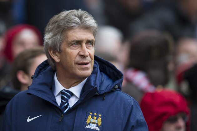 Manchester City's manager Manuel Pellegrini takes to the touchline before his team's English Premier League soccer match between Manchester United and Manchester City at Old Trafford Stadium, Manchester, England, Sunday, April 12, 2015. (AP Photo/Jon Super)