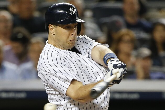 New York Yankees' Mark Teixeira misses on a pitch from Boston Red Sox starting pitcher Steven Wright in the sixth inning of a baseball game at Yankee Stadium in New York, Wednesday, Aug. 5, 2015.  (AP Photo/Kathy Willens)