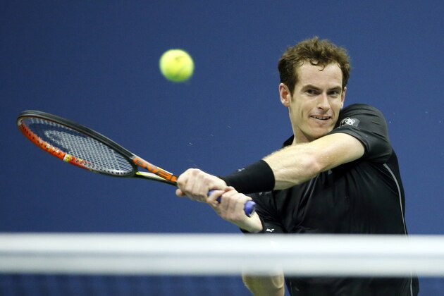 Andy Murray, of Britain, returns a shot to Nick Kyrgios, of Australia, during the first round of the U.S. Open tennis tournament in New York, Tuesday, Sept. 1, 2015. (AP Photo/Julio Cortez)