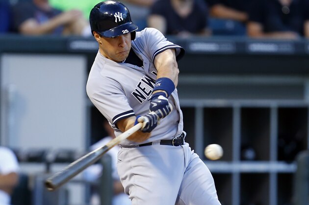 New York Yankees first baseman Mark Teixeira (25) hits a grand slam home run during the second inning of a baseball game against the Chicago White Sox in Chicago, on Friday, July 31, 2015. (AP Photo/Jeff Haynes)