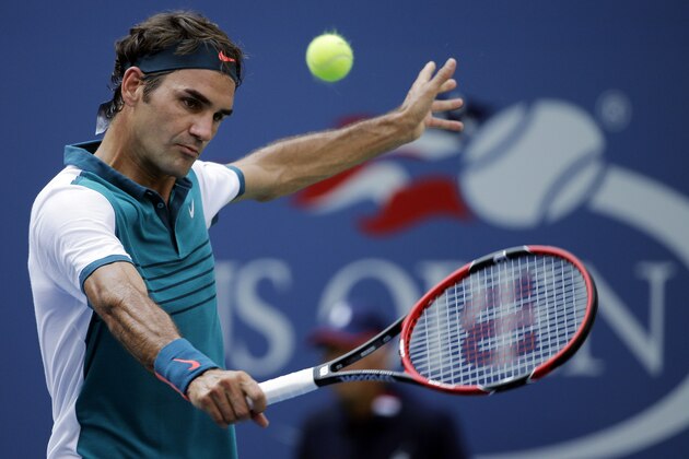 Roger Federer, of Switzerland, returns to Leonardo Mayer, of Argentina, during the first round of the U.S. Open tennis tournament, Tuesday, Sept. 1, 2015, in New York. (AP Photo/Matt Rourke)
