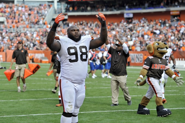 Cleveland Browns defensive end Phil Taylor (98) gestures to fans after a 26-24 win over the New Orleans Saints in an NFL football game Sunday, Sept. 14, 2014, in Cleveland. (AP Photo/David Richard)