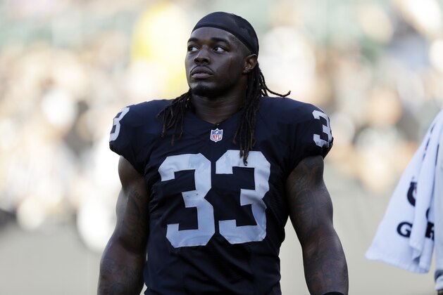 Oakland Raiders running back Trent Richardson (33) warms up before an NFL preseason football game in Oakland, Calif., Friday, Aug. 14, 2015. (AP Photo/Ben Margot)
