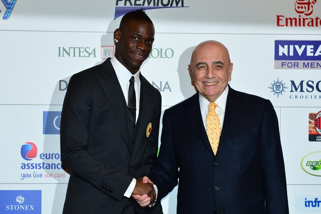 New AC Milan player, Italian striker Mario Balotelli (L) poses with AC Milan sporting director Adriano Galliani during a press conference on February 1, 2013 at San Siro Stadium in Milan. AFP PHOTO / GIUSEPPE CACACE        (Photo credit should read GIUSEPPE CACACE/AFP/Getty Images)