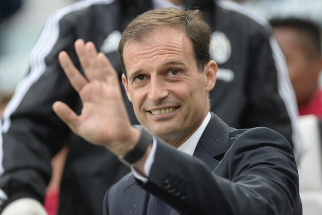 Juventus' coach Massimiliano Allegri waves prior to a Serie A soccer match between Juventus and Udinese at the Juventus stadium, in Turin, Italy, Sunday, Aug. 23, 2015. (AP Photo/Massimo Pinca)