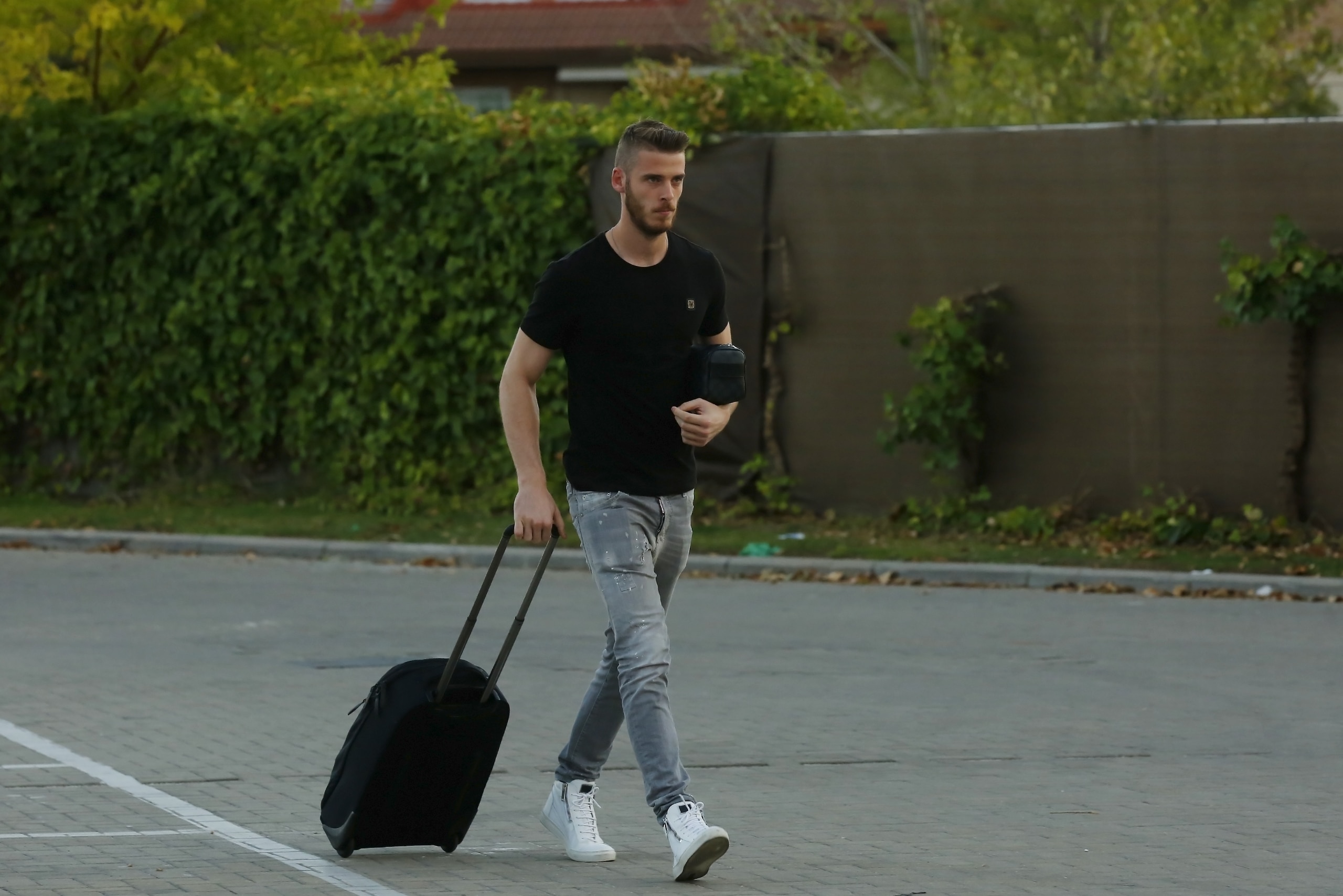 Manchester United's goalkeeper David De Gea of Spain arrives at Soccer City training facility for a Spanish soccer team concentration meeting in Las Rozas, near Madrid, Spain, Tuesday, Sept. 1, 2015. The day after De Gea's multi-million euro move to the Spanish capital was called off, Madrid pointed the finger at United, issuing a lengthy 10-point statement claiming officials at Old Trafford held the deal up with their delays, but United hit back at their old rivals by publishing a counter-statement on Tuesday evening.(AP Photo)