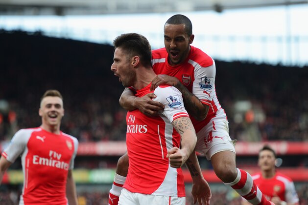 LONDON, ENGLAND - MARCH 14:  Olivier Giroud of Arsenal celebrates scoring the opening goal with Theo Walcott (R) during the Barclays Premier League match between Arsenal and West Ham United at Emirates Stadium on March 14, 2015 in London, England.  (Photo by Jamie McDonald/Getty Images)