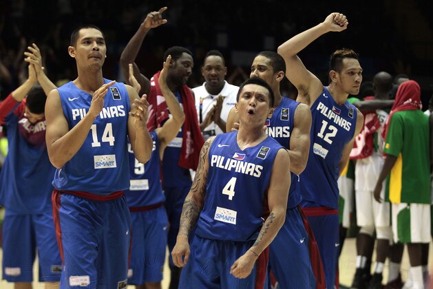 Philippines' Japeth Aguilar, left, and teammate Jim Alapag, right, celebrates after winning the match at the end of the match  against Senegal during the Group B Basketball World Cup match between the Philippines and Senegal in Seville, Spain, Thursday, Sept. 4, 2014. The 2014 Basketball World Cup competition will take place in various cities in Spain from Aug. 30 through to Sept. 14. (AP Photo/Miguel Angel Morenatti)