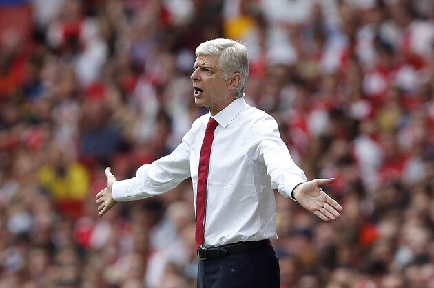 Arsenal's manager Arsene Wenger gestures during the English Premier League soccer match between Arsenal and West Ham at the Emirates stadium in London, Sunday, Aug. 9, 2015.(AP Photo/Frank Augstein)