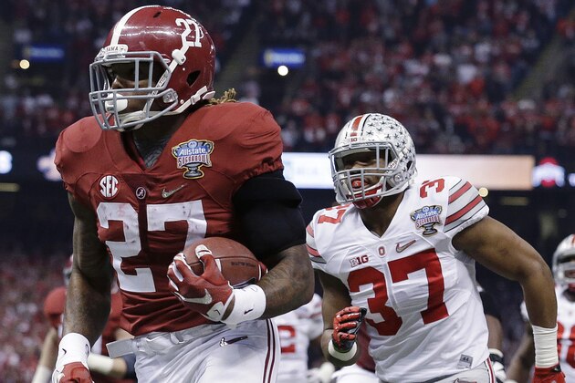 Alabama running back Derrick Henry (27) runs toward the end zone against Ohio State linebacker Joshua Perry (37) in the first half of the Sugar Bowl NCAA college football playoff semifinal game, Thursday, Jan. 1, 2015, in New Orleans. Henry scored a touchdown on the play. (AP Photo/Brynn Anderson)