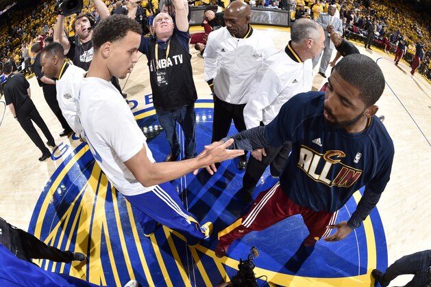 OAKLAND, CA - JUNE 4: Stephen Curry #30 of the Golden State Warriors and Kyrie Irving #2 of the Cleveland Cavaliers shake hands before Game One of the 2015 NBA Finals on June 4, 2015 at Oracle Arena in Oakland, California. NOTE TO USER: User expressly acknowledges and agrees that, by downloading and or using this photograph, user is consenting to the terms and conditions of Getty Images License Agreement. Mandatory Copyright Notice: Copyright 2015 NBAE (Photo by Andrew D. Bernstein/NBAE via Getty Images)