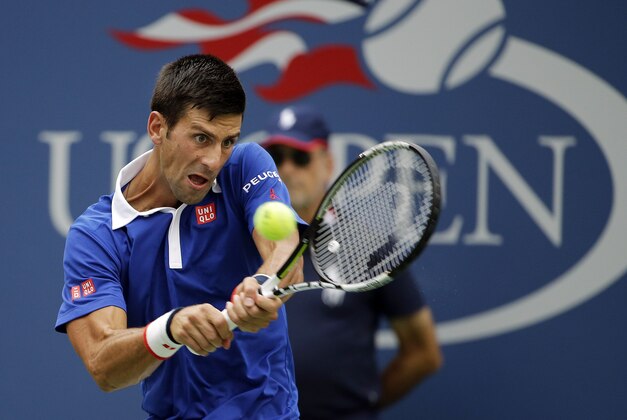 Novak Djokovic, of Serbia, returns a shot against Joao Souza, of Brazil, during the first round of the U.S. Open tennis tournament, Monday, Aug. 31, 2015, in New York. (AP Photo/Matt Rourke)