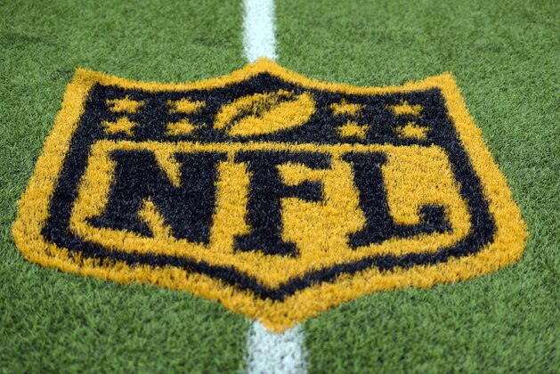 A gold NFL logo is on the field at Ralph Wilson Stadium before a preseason NFL football game between the Buffalo Bills and the Pittsburgh Steelers on Saturday, Aug. 29, 2015, in Orchard Park, N.Y. (AP Photo/Gary Wiepert)