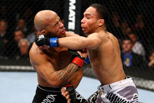 CHICAGO, IL - JANUARY 26:  John Dodson (R) punches Demetrious Johnson (L) during thier Flyweight Championship Bout part of UFC on FOX at United Center on January 26, 2013 in Chicago, Illinois.  (Photo by Al Bello/Zuffa LLC/Zuffa LLC Via Getty Images)