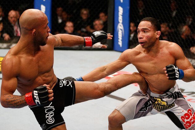 CHICAGO, IL - JANUARY 26:  (L-R) Demetrious Johnson kicks John Dodson in their flyweight championship fight during the UFC on FOX event on January 26, 2013 at United Center in Chicago, Illinois. (Photo by Josh Hedges/Zuffa LLC/Zuffa LLC via Getty Images)