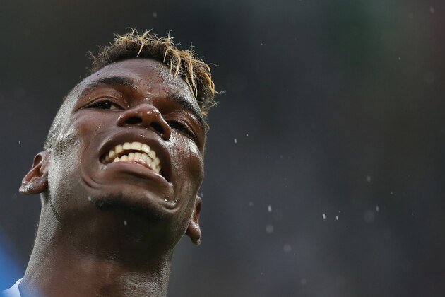 Juventus' midfielder from France, Paul Pogba reacts during the Italian Serie A football match Juventus Vs Udinese on August 23, 2015 at the 'Juventus Stadium' in Turin.  AFP PHOTO / MARCO BERTORELLO        (Photo credit should read MARCO BERTORELLO/AFP/Getty Images)