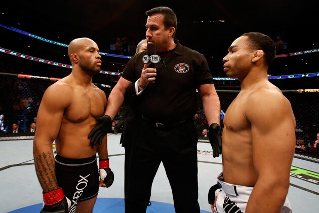 CHICAGO, IL - JANUARY 26:  John Dodson (R) face off with Demetrious Johnson (L) during thier Flyweight Championship Bout part of UFC on FOX at United Center on January 26, 2013 in Chicago, Illinois.  (Photo by Josh Hedges/Zuffa LLC/Zuffa LLC Via Getty Images)
