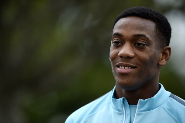 French forward Anthony Martial looks on as he arrives for a training session in Clairefontaine-en-Yvelines on September 2, 2015, two days ahead of the team friendly football match against Portugal. AFP PHOTO / FRANCK FIFE        (Photo credit should read FRANCK FIFE/AFP/Getty Images)