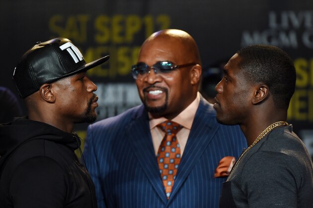 Boxers Floyd 'Money' Mayweather (L) and Andre Berto (R) face off during a press conference to officially announce their September 12 fight that will place at the MGM Grand Garden Arena in Las Vegas, at the Marriott Hotel in Los Angeles, California on August 6, 2015.  Mayweather claims it will be the last ever opportunity to see him fight.          AFP PHOTO / MARK RALSTON        (Photo credit should read MARK RALSTON/AFP/Getty Images)