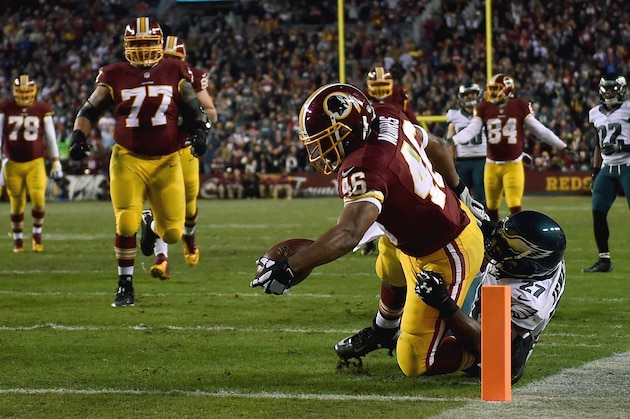 LANDOVER, MD - DECEMBER 20: Running back Alfred Morris #46 of the Washington Redskins scores a first quarter touchdown against the defense of free safety Malcolm Jenkins #27 of the Philadelphia Eagles  at FedExField on December 20, 2014 in Landover, Maryland.  (Photo by Patrick Smith/Getty Images)