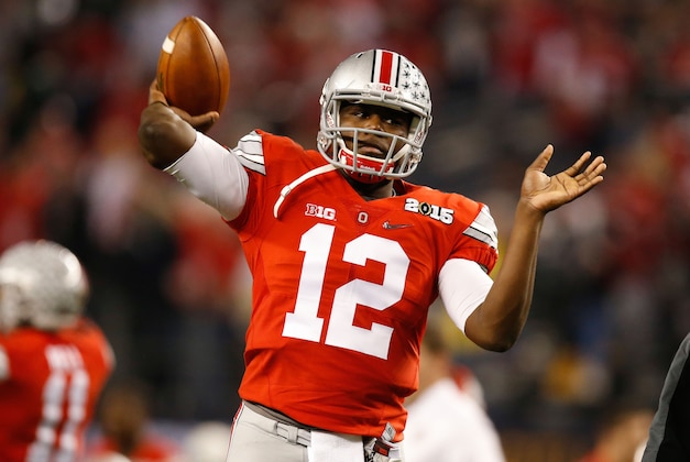 Jan 12, 2015; Arlington, TX, USA; Ohio State Buckeyes quarterback Cardale Jones (12) throws the ball in warmups before the game against the Oregon Ducks in the 2015 CFP National Championship Game at AT&T Stadium. Ohio State won 42-20. Mandatory Credit: Tim Heitman-USA TODAY Sports
