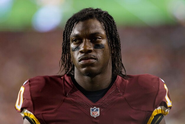 Aug 20, 2015; Landover, MD, USA; Washington Redskins quarterback Robert Griffin III (10) walks off the field after being injured against the Detroit Lions at FedEx Field. Mandatory Credit: Geoff Burke-USA TODAY Sports