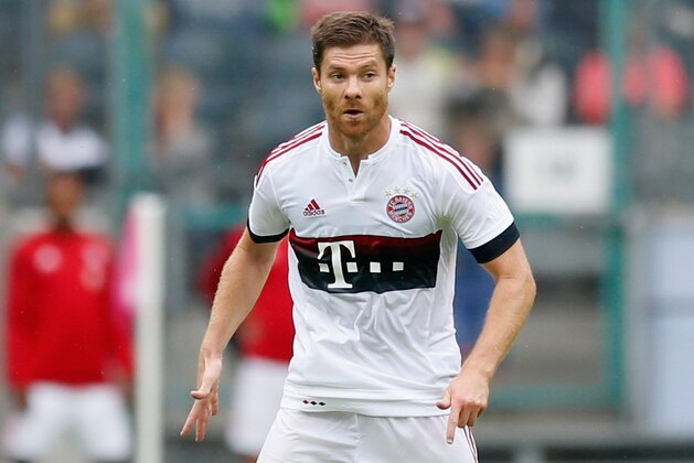 MOENCHENGLADBACH, GERMANY - JULY 12:  Xabi Alonso of Bayern runs with the ball during the Telekom Cup 2015 Semi Final match between FC Bayern Muenchen and FC Augsburg at Borussia-Park on July 12, 2015 in Moenchengladbach, Germany.  (Photo by Boris Streubel/Getty Images)