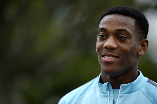 French forward Anthony Martial looks on as he arrives for a training session in Clairefontaine-en-Yvelines on September 2, 2015, two days ahead of the team friendly football match against Portugal. AFP PHOTO / FRANCK FIFE        (Photo credit should read FRANCK FIFE/AFP/Getty Images)