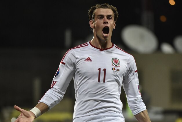 Wales forward Gareth Bale celebrates after scoring a goal during the Euro 2016 qualifying round football match Andorra vs Wales on September 9, 2014 at the Municipal Stadium in Andorra. AFP PHOTO / PASCAL PAVANI        (Photo credit should read PASCAL PAVANI/AFP/Getty Images)