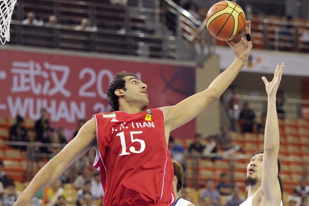Hamed Haddadi of Iran (L) fights for a rebound against Tseng Wen-Ting of Taiwan (R) during their preliminary round match at the 26th Asian Basketball Championships on September 15, 2011. Iran won 49-37.   AFP PHOTO / LIU JIN (Photo credit should read LIU JIN/AFP/Getty Images)