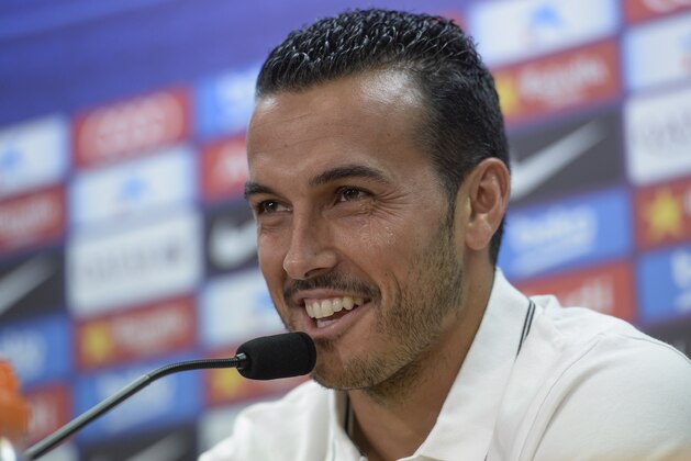 Barcelona's former forward Pedro Rodriguez smiles during a farewell press conference for his departure from the club to English football team Chelsea at the Sports Center FC Barcelona Joan Gamper in Sant Joan Despi, near Barcelona on August 24, 2015. Chelsea's new winger Pedro Rodriguez has revealed he chose the Blues over English rivals Manchester United despite appearing set for a move to Old Trafford.  AFP PHOTO / JOSEP LAGO        (Photo credit should read JOSEP LAGO/AFP/Getty Images)