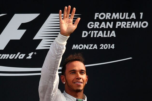 MONZA, ITALY - SEPTEMBER 07:  Lewis Hamilton of Great Britain and Mercedes GP celebrates following his victory during the F1 Grand Prix of Italy at Autodromo di Monza on September 7, 2014 in Monza, Italy.  (Photo by Bryn Lennon/Getty Images)