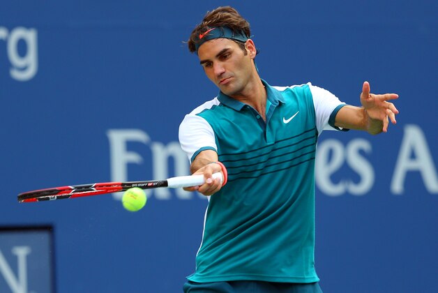 Sep 1, 2015; New York, NY, USA; Roger Federer of Switzerland returns a shot to Leonardo Mayer of Argentina on day two of the 2015 U.S. Open tennis tournament at USTA Billie Jean King National Tennis Center. Mandatory Credit: Jerry Lai-USA TODAY Sports