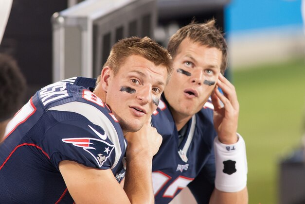 Aug 28, 2015; Charlotte, NC, USA; New England Patriots tight end Rob Gronkowski (87) and quarterback Tom Brady (12) sit on the bench during the second half against the Carolina Panthers at Bank of America Stadium. The Patriots defeated the Panthers 17-16. Mandatory Credit: Jeremy Brevard-USA TODAY Sports