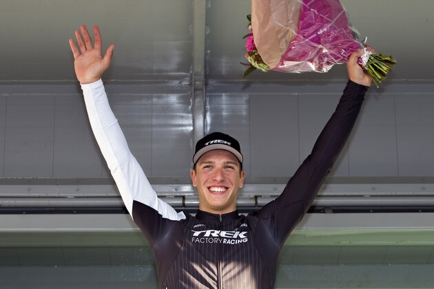 Netherlands' Danny Van Poppel (C) of Trek Factory Racing celebrates on the podium after winning the first stage of the 'Driedaagse van West Vlaanderen' three day cycling race, 182,9 km from Brugge to Harelbeke, on March 8, 2014 in Harelbeke.  AFP PHOTO / BELGA / KRISTOF VAN ACCOM   **Belgium Out**        (Photo credit should read KRISTOF VAN ACCOM/AFP/Getty Images)