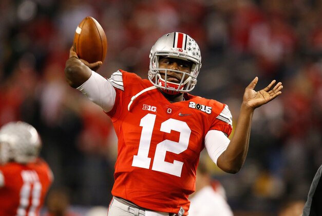 Jan 12, 2015; Arlington, TX, USA; Ohio State Buckeyes quarterback Cardale Jones (12) throws the ball in warmups before the game against the Oregon Ducks in the 2015 CFP National Championship Game at AT&T Stadium. Ohio State won 42-20. Mandatory Credit: Tim Heitman-USA TODAY Sports