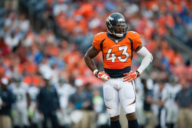 DENVER, CO - AUGUST 07:  Strong safety T.J. Ward #43 of the Denver Broncos stands on the field during a pause in the game against the Seattle Seahawks during preseason action at Sports Authority Field at Mile High on August 7, 2014 in Denver, Colorado.  (Photo by Dustin Bradford/Getty Images)