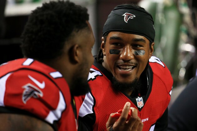 ATLANTA, GA - AUGUST 14: Vic Beasley #44 of the Atlanta Falcons talks to a teammate on the sidelines in the first half of a preseason game against the Tennessee Titans at the Georgia Dome on August 14, 2015 in Atlanta, Georgia.  (Photo by Daniel Shirey/Getty Images)