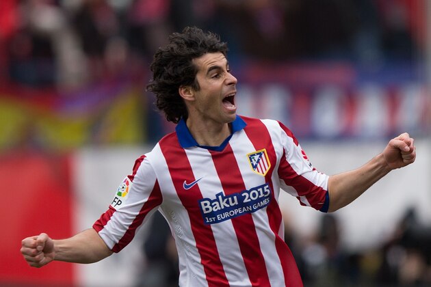 MADRID, SPAIN - FEBRUARY 07:  Tiago Mendes of Atletico de Madrid celebrates scoring their opening goal  during the La Liga match between Club Atletico de Madrid and Real Madrid CF at Vicente Calderon Stadium on February 7, 2015 in Madrid, Spain.  (Photo by Gonzalo Arroyo Moreno/Getty Images)
