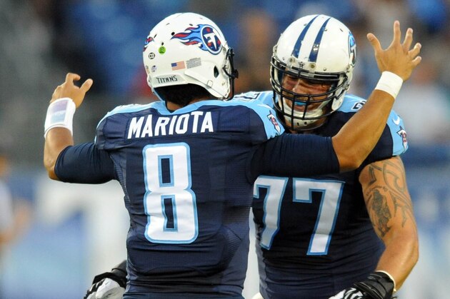 Sep 3, 2015; Nashville, TN, USA; Tennessee Titans quarterback Marcus Mariota (8) celebrates with offensive tackle Taylor Lewan (77) after a touchdown pass during the first half against the Minnesota Vikings at Nissan Stadium. Mandatory Credit: Christopher Hanewinckel-USA TODAY Sports
